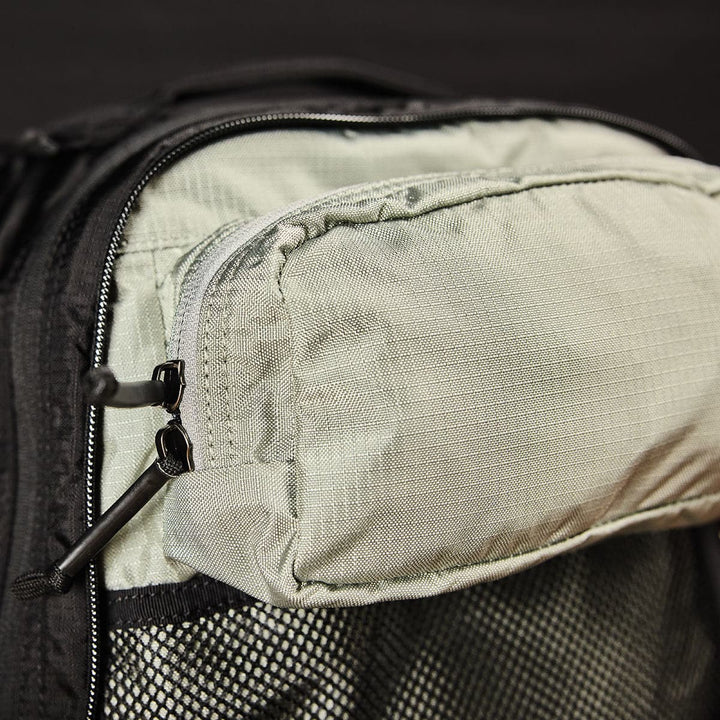 The interior of the GORUCK Bullet Ruck Double Compartment - Ripstop Nylon backpack features a zippered mesh pocket and dual compartments, ideal for organizing essentials.