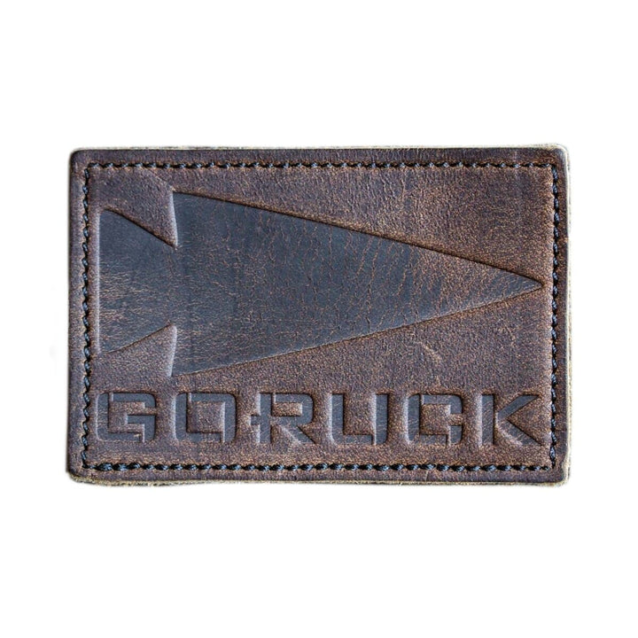 Patch crafted from genuine brown leather, showcasing an embossed spearhead and the text "GORUCK".