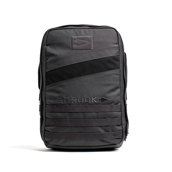 The GORUCK Rucker 4.0 is a black tactical rucksack featuring a minimalist design with diagonal stripe accents, ideal for rucking adventures.