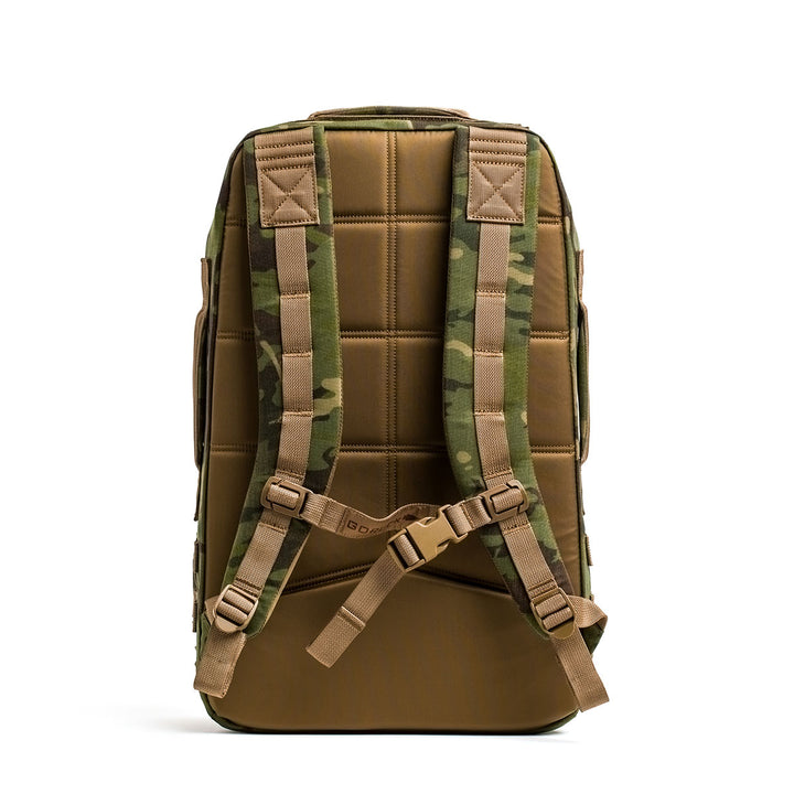 The Rucker 4.0 by GORUCK, set against a white background, boasts padded straps and secure buckles designed for comfort and durability with its camouflage design.