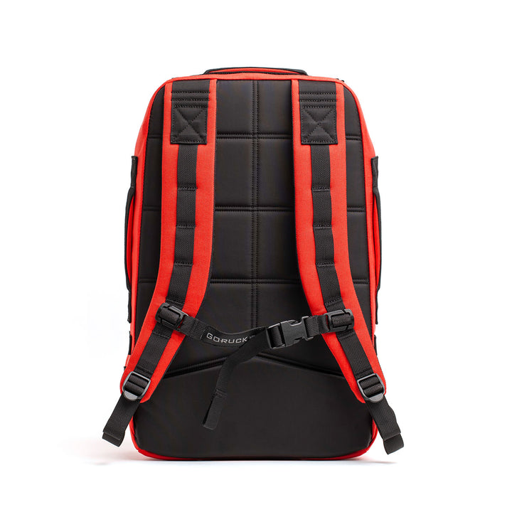 The GORUCK Rucker 4.0 backpack, designed for rucking with padded straps, is displayed from the back against a white background in black and red colors.