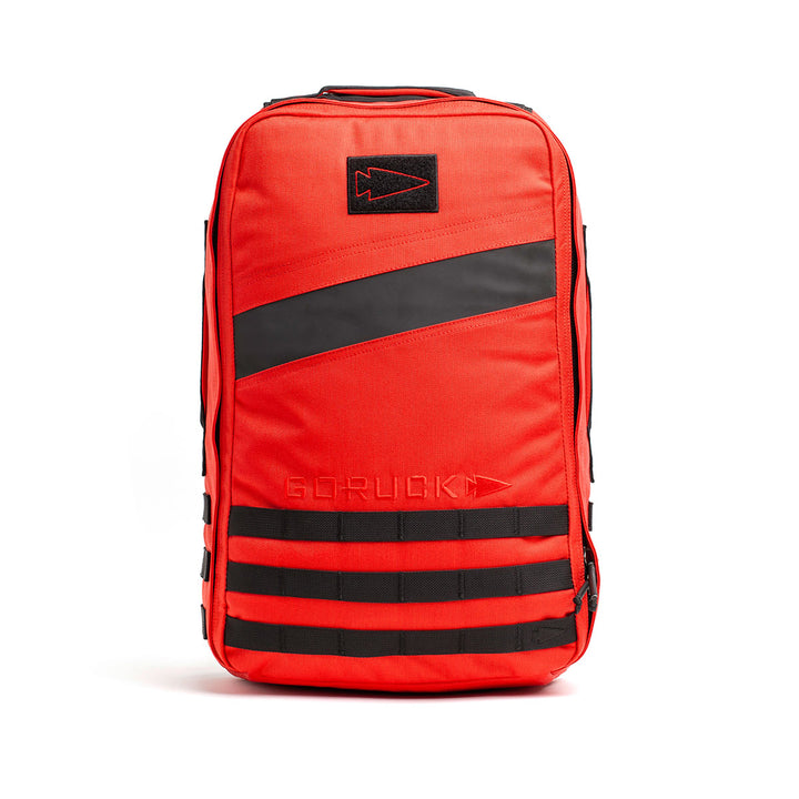 A durable GORUCK Rucker 4.0 backpack in red and black, featuring a rugged design and multiple compartments.