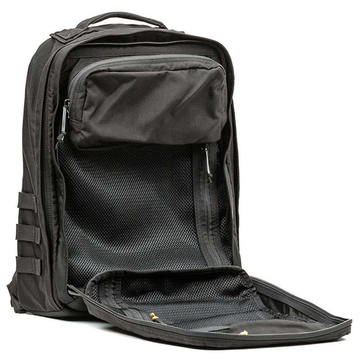 The GR2 - USA backpack in black by GORUCK, made from durable 210D CORDURA®, includes open compartments with mesh pockets, making it the ideal carry-on compliant option for travelers.