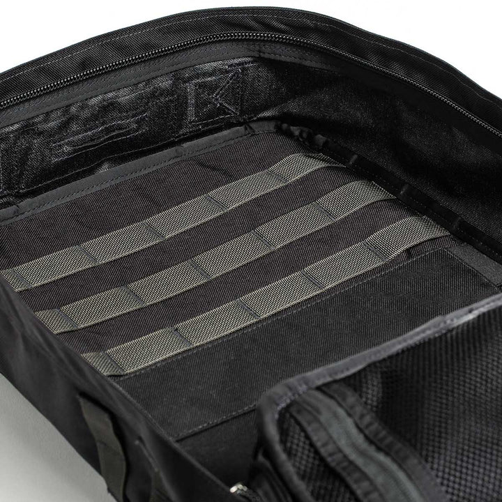 The GORUCK GR2 - USA in black highlights its 210D CORDURA® interior, complete with compartments and horizontal straps for organized packing. Its design is carry-on compliant, making it ideal for travel.