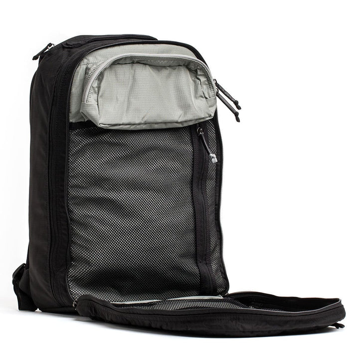 Capture the Bullet Ruck Double Compartment by GORUCK, a black backpack made from ripstop nylon, featuring two compartments, a mesh pocket, and a gray interior lining set against a white background.