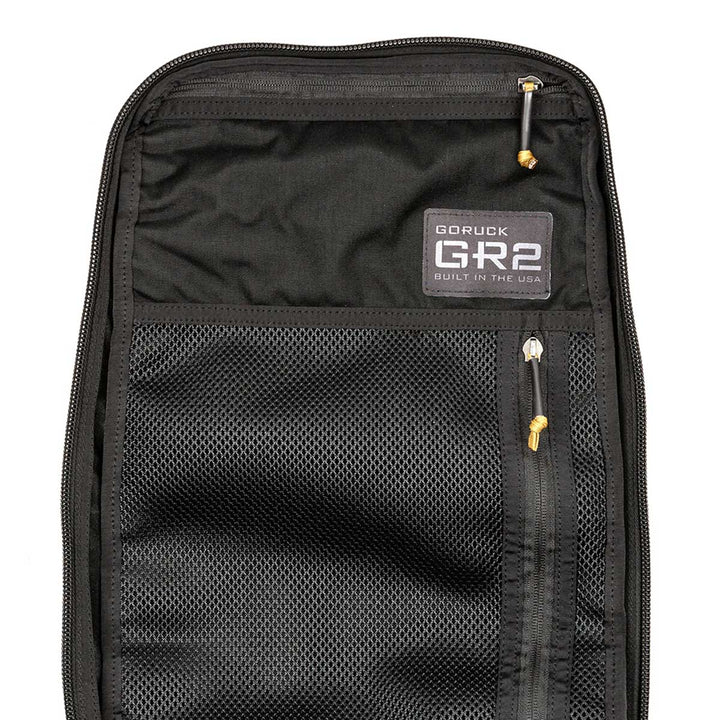 Discover the GORUCK GR2 - USA backpack in Black, designed with a versatile interior that includes mesh pockets and zippers. Made from robust 210D CORDURA®, this carry-on compliant bag is an ideal travel companion for those who are always on the move.