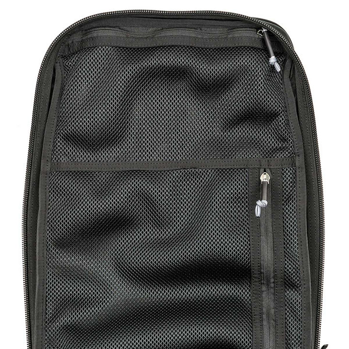 The GR2 - USA by GORUCK is a black mesh travel organizer featuring multiple zippers, designed to fit snugly into any rucksack. It is carry-on compliant and comes with the Scars Lifetime Guarantee, ensuring durability for all your adventures.