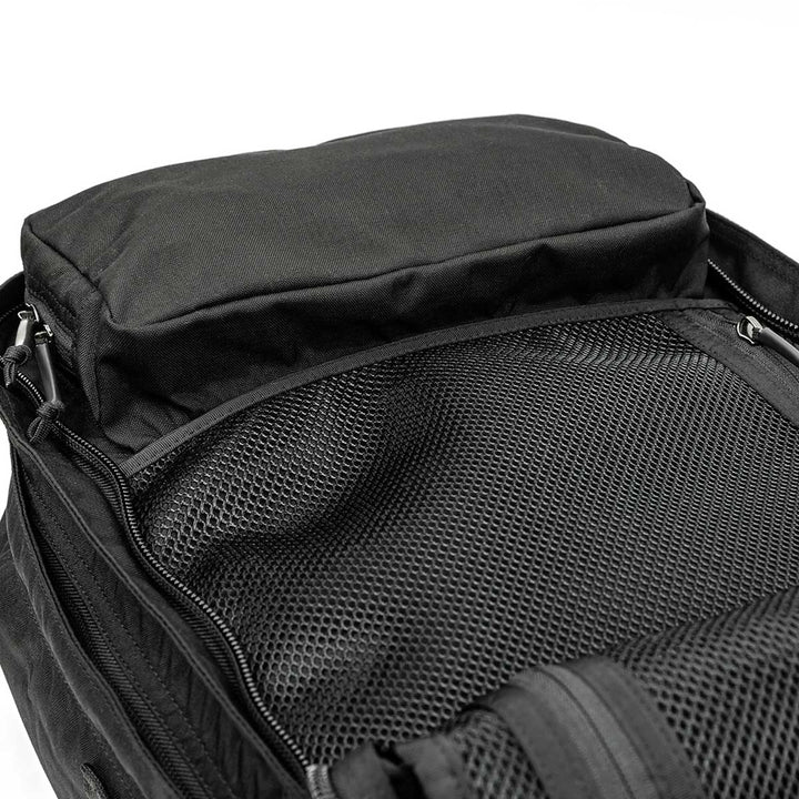 Open the GR2 - USA black backpack by GORUCK, featuring a mesh compartment and zippered pockets for organized storage. Made from durable 210D CORDURA®, this stylish carry-on compliant backpack ensures practicality for every journey.