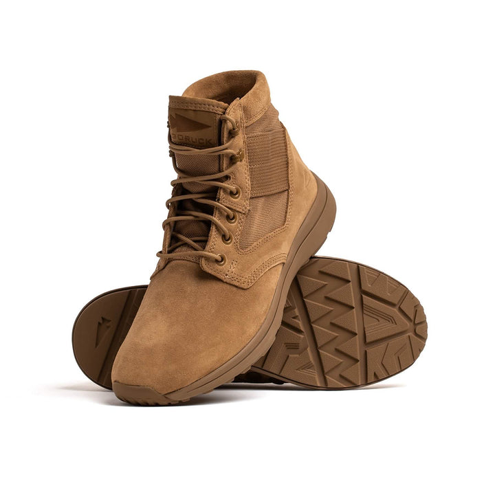 The GORUCK MACV-1 Hi-Speed Mid Top tan rucking boots, displayed upright and tilted to reveal the rugged sole and lightweight EVA midsole, are set against a white background.