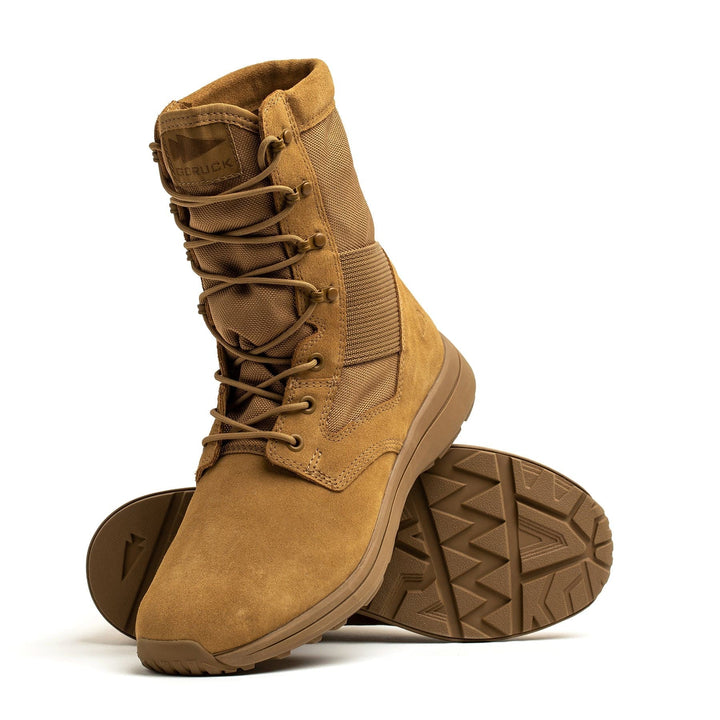 Tan GORUCK MACV-1 Hi-Speed high-top boots featuring rugged soles; one boot is upright while the other is tilted for a side view. These lightweight tactical boots are AR670-1 compliant, offering both durability and adherence to uniform standards.