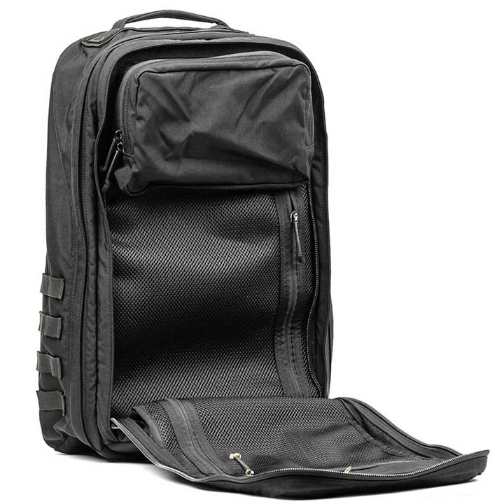 Introducing the GR2 - USA by GORUCK, a sleek black rucksack designed with multiple compartments and zippers to keep you organized wherever you go. This carry-on compliant bag is crafted for durability and comes with the Scars Lifetime Guarantee, making it a reliable companion for years to come.