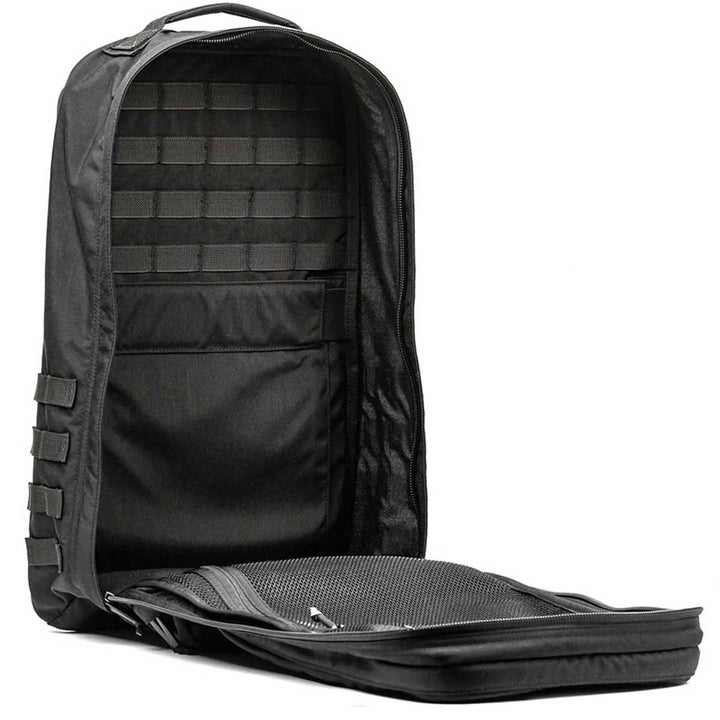 The GR2 - USA by GORUCK is a black tactical rucksack featuring an open main compartment and a mesh pocket, ideal for carry-on compliance.