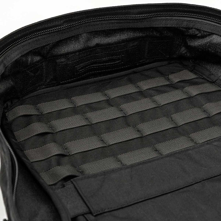 The open GR2 - USA rucksack from GORUCK reveals a neatly organized interior with greenish-black straps and compartments, all backed by the reassurance of the Scars Lifetime Guarantee.