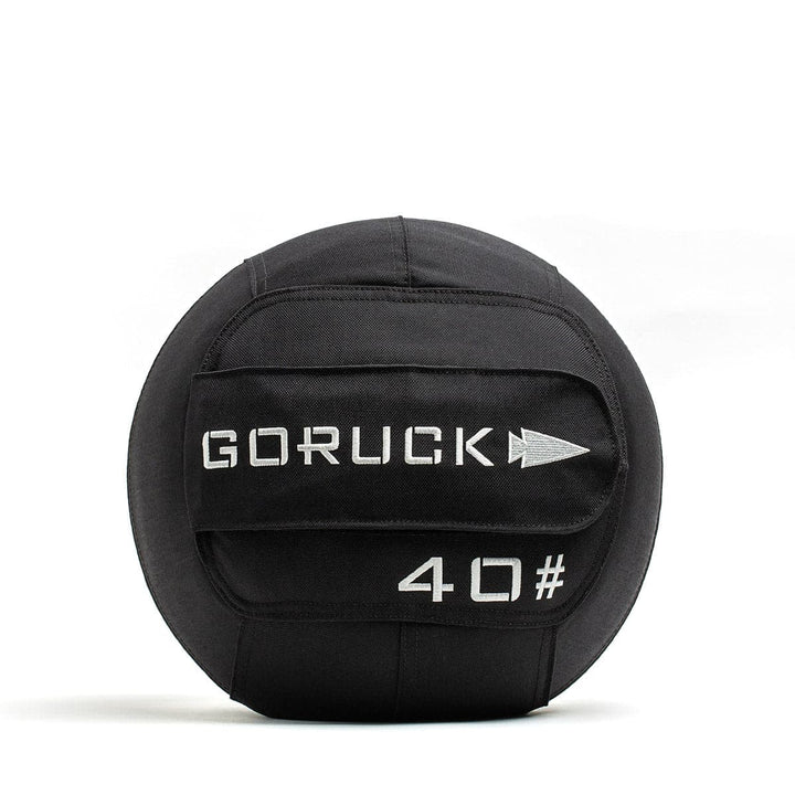 A GORUCK Sand Medicine Ball with a 40-pound weight label, featuring a convenient handle on a white background, ideal for boosting core stability in your home gym.