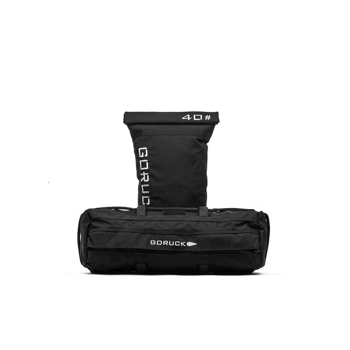 A black GORUCK Sandbag Kit (w/ Filler Bag) with a rolled closure, labeled "40" in white. It features heavy-duty handles for easy carrying and maneuverability, backed by the Scars Lifetime Guarantee, isolated on a white background.