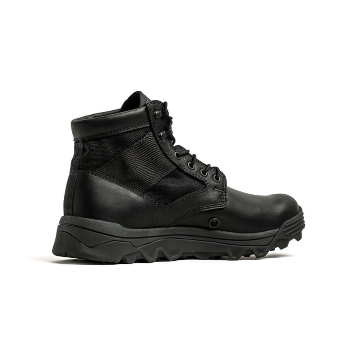 Introducing the MACV-2 - Mid Top - Black by GORUCK: a rugged ankle boot featuring a thick, triple compound outsole and a classic lace-up design. This boot combines leather and fabric with side stitching, showcasing sturdy construction reminiscent of a jungle boot—ideal for outdoor adventures or heavy-duty use.