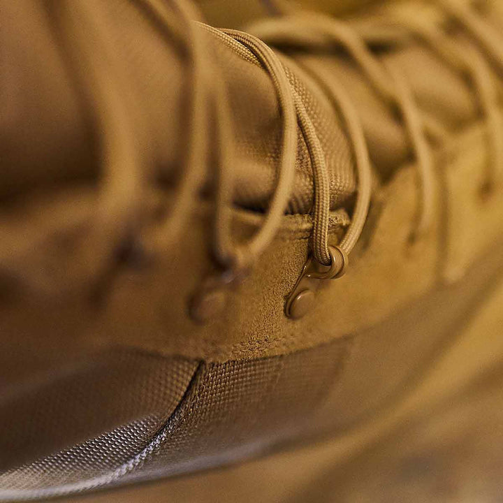 Close-up of a brown MACV-1 Hi-Speed - High Top, crafted by GORUCK, highlighting its detailed lacing and texture, while ensuring a lightweight design.