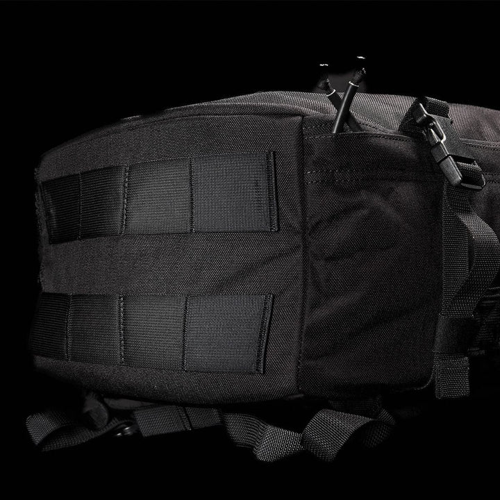 Close-up of a black GORUCK GR3 - Cordura tactical backpack against a dark background. The image highlights the rugged, water-resistant material and multiple straps, showcasing its durability and functional design as an ideal carry-on rucksack.