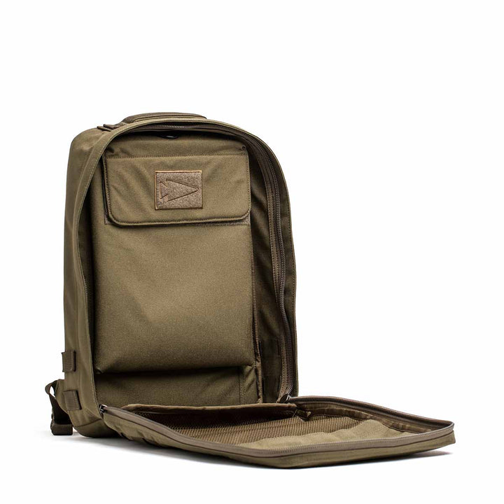 The GORUCK Rucker 4.0 in olive green features an unzipped compartment with internal pockets and storage, ideal for rucking enthusiasts.