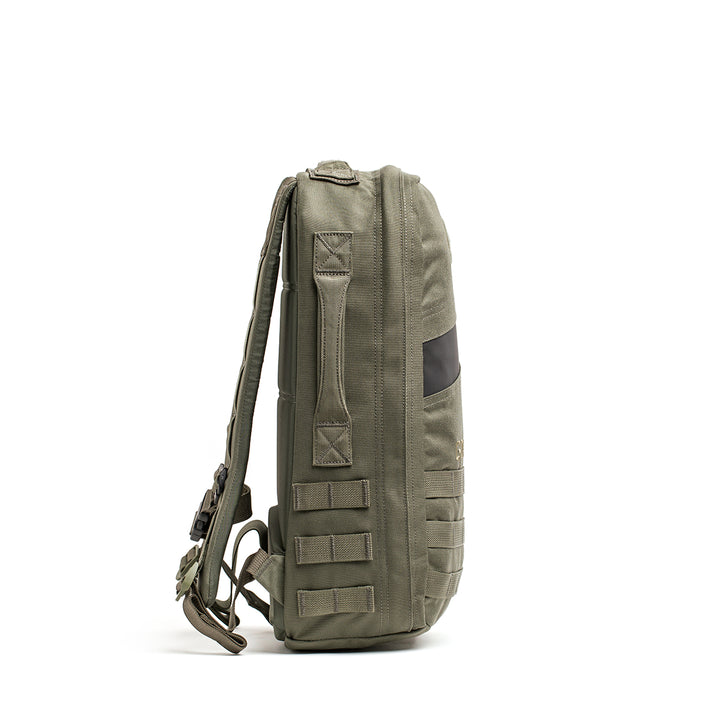 Side view of a GORUCK Rucker 4.0 rucksack in olive green, featuring multiple straps and a black panel.