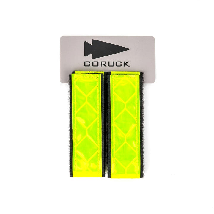 Two vivid Reflective Ruck Bands from GORUCK stand out against a white background, ensuring visibility at night.