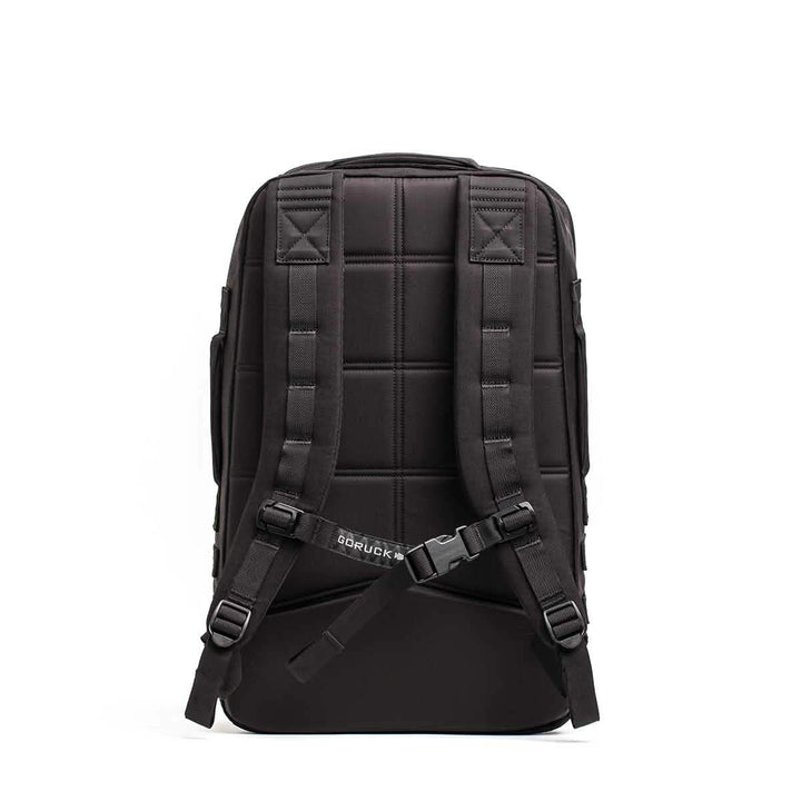 The GORUCK Rucker 4.0 backpack, in black with padded straps and a waist buckle, ideal for rucking activities, is displayed on a white background.