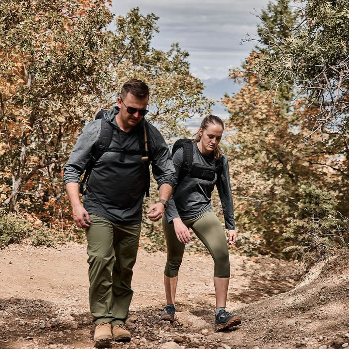 Two people rucking in the mountains. Man is wearing Men's Long Sleeve Performance Tee - ToughMesh Charcoal