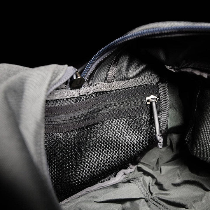 Open black Kit Bag by GORUCK, resembling a Special Forces Flight Bag and featuring a zippered mesh pocket inside.