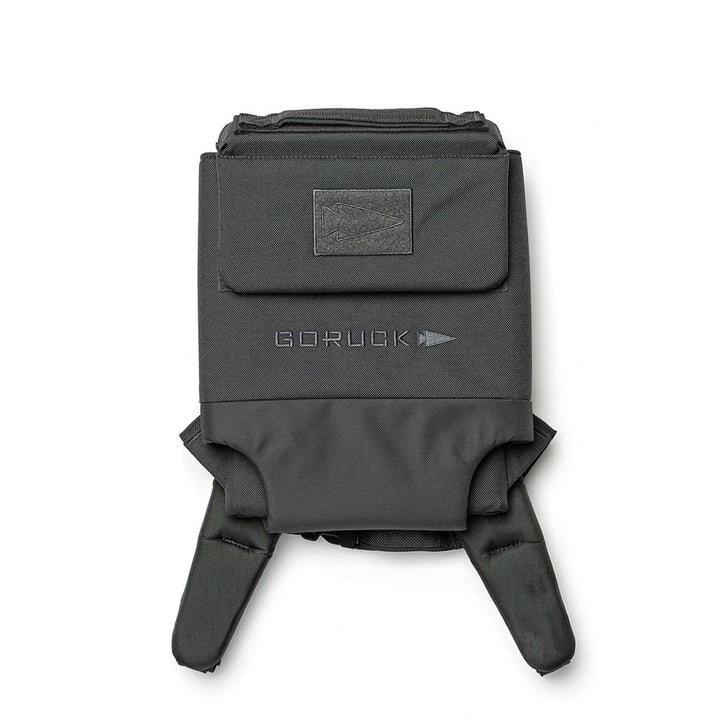 The GORUCK Ruck Plate Carrier 3.0, made from durable ballistic nylon, includes convenient handles and a front pocket, making it ideal for weight training.