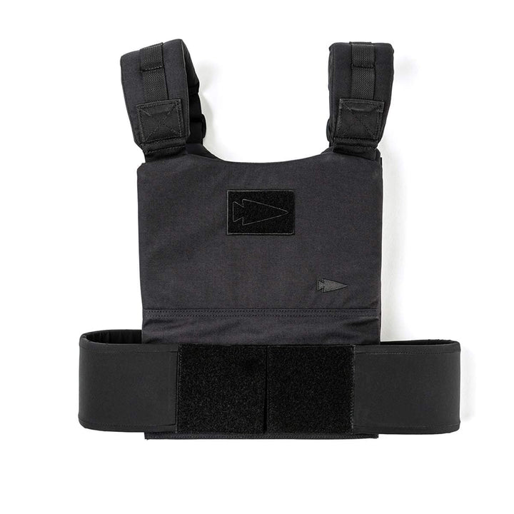 The GORUCK Training Weight Vest in black features adjustable straps and Velcro closures, ideal for security or military applications. This versatile vest allows you to customize the weight, making it perfect for boosting your strength and endurance during workouts.