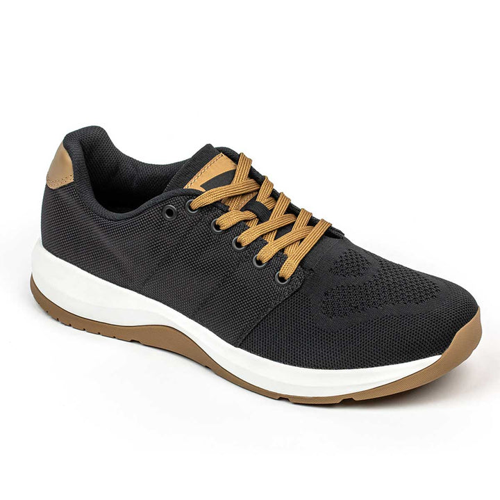 The Ballistic Trainers by GORUCK, with their black exterior complemented by tan laces and a brown sole, are set against a white background. Designed for both men and women aiming for functional fitness footwear, these trainers excel in providing stability. The 3X Support feature is engineered to boost your performance.