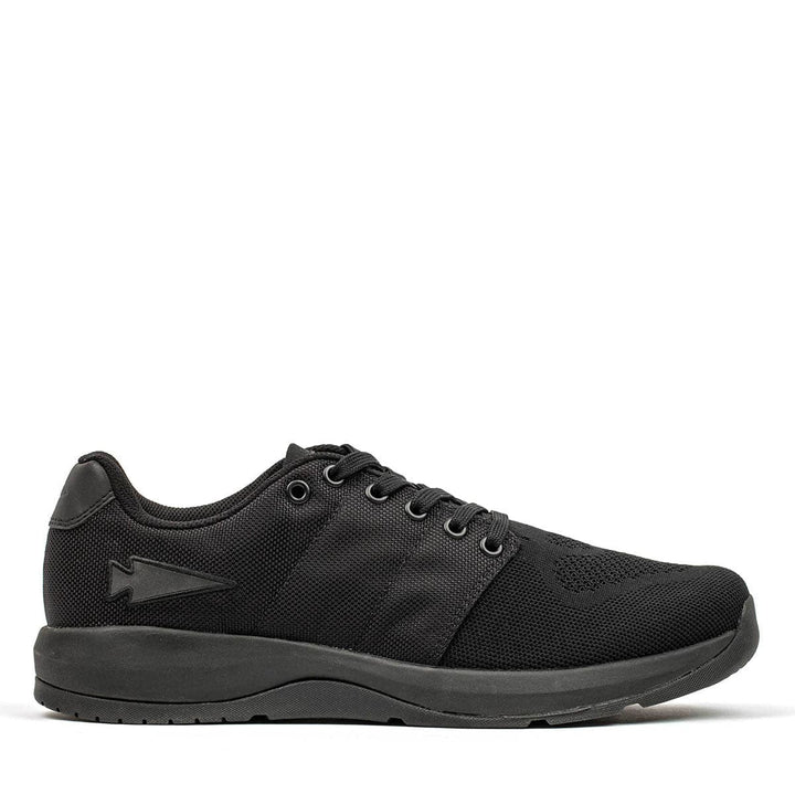 Introducing the Men's Ballistic Trainers in Blackout with Black Reflective Spearhead by GORUCK. These athletic shoes are made from CORDURA® Ballistic Nylon and feature mesh detailing along with a subtle arrow design on the side. Complete with a black sole and laces, this sleek footwear is perfect for both functional fitness activities and casual wear.