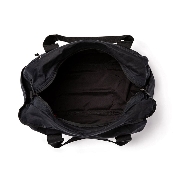 Top view of an open GORUCK Kit Bag - Waxed Canvas with visible interior lining, highlighting its sleek design.