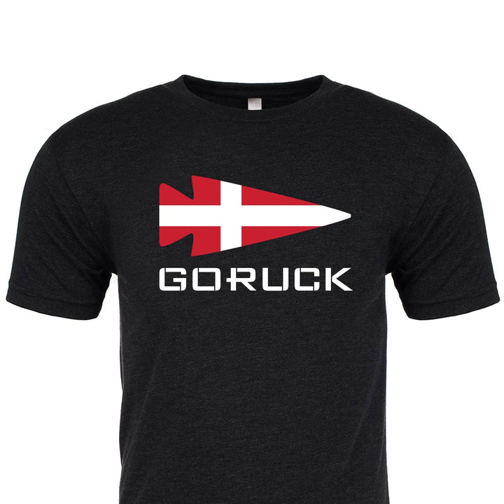 Black classic T-shirt named "Rep Your Country" from GORUCK EU, showcasing a white and red arrow design with the text "GORUCK" on the front, made from premium tri-blend material for maximum comfort and durability.