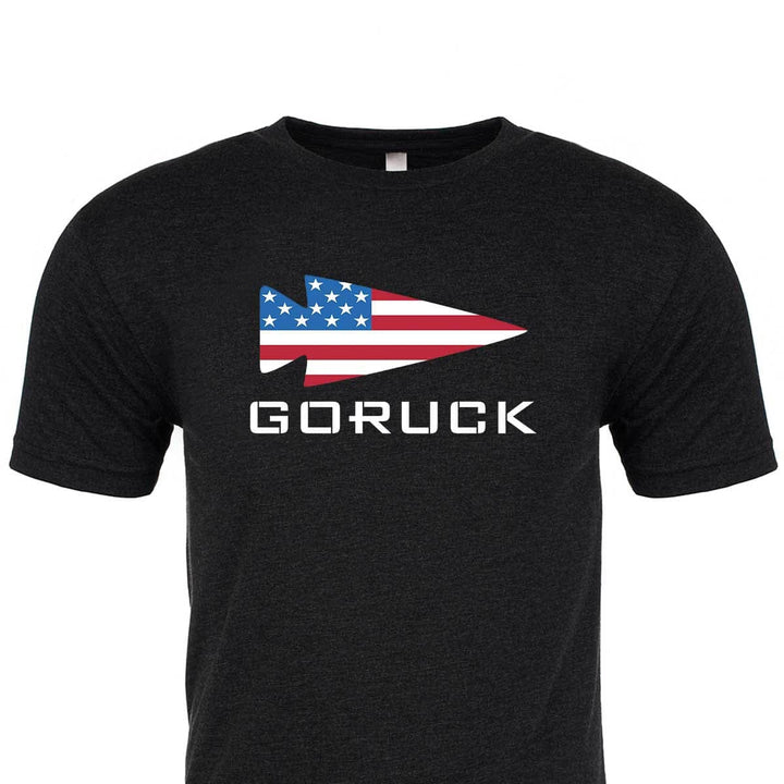 Check out our premium "Rep Your Country" tri-blend black t-shirt from GORUCK EU. It showcases a striking American flag arrowhead design with "GORUCK" gracefully printed below, offering exceptional comfort and style that makes it an essential addition to any wardrobe.