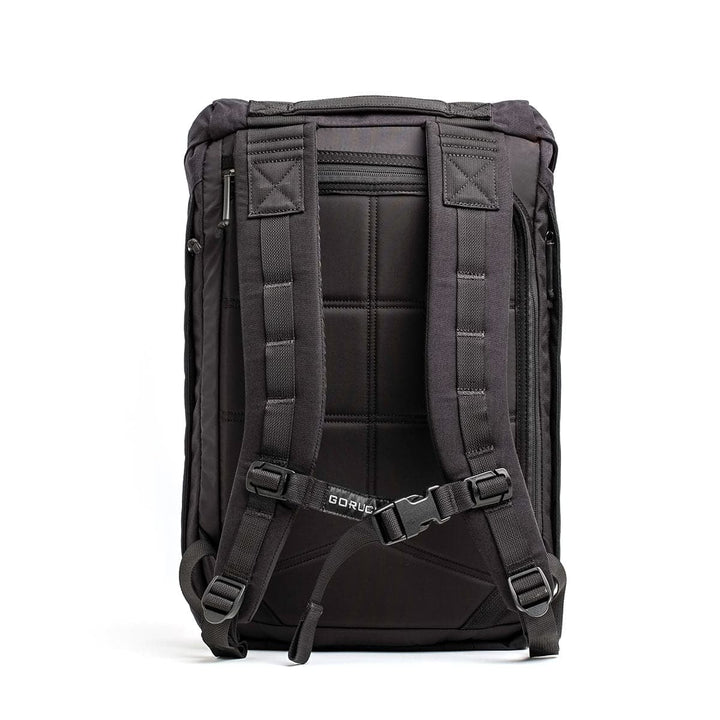 Introducing the GORUCK M23 - Cordura, a black backpack expertly crafted from durable materials. It includes padded straps and a back panel for added comfort and features adjustable shoulder straps with a sternum strap. The design also integrates multiple loops and compartments for versatile storage. Its minimalist aesthetic makes it ideal for both outdoor adventures and urban use.