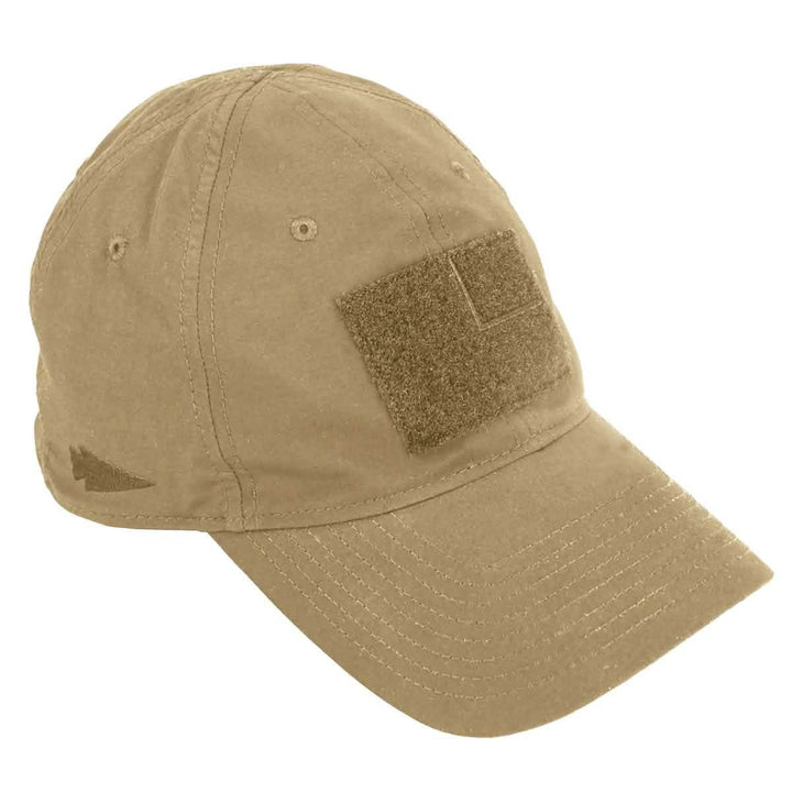 The Performance TAC Hat - TOUGHDRY by GORUCK is a tan baseball cap made with ToughDry® fabric. It features a rectangular patch on the front and a small arrow logo on the side, offering both durability and comfort. The hat is equipped with an adjustable VELCRO® strap for a perfect fit.