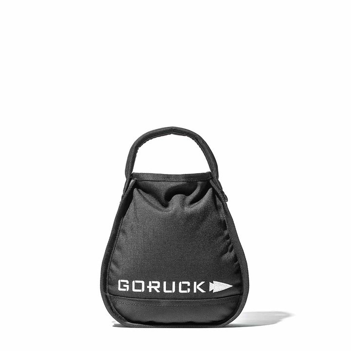 A black Sand Kettlebell by GORUCK, featuring an endurance design with a logo and a top handle, isolated on a white background.