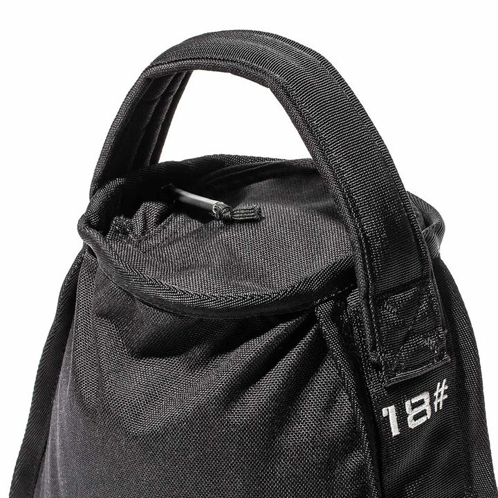 The versatile GORUCK Sand Kettlebells, distinguished by their black sandbag design and convenient handles, are labeled "18#" for effective strength training.