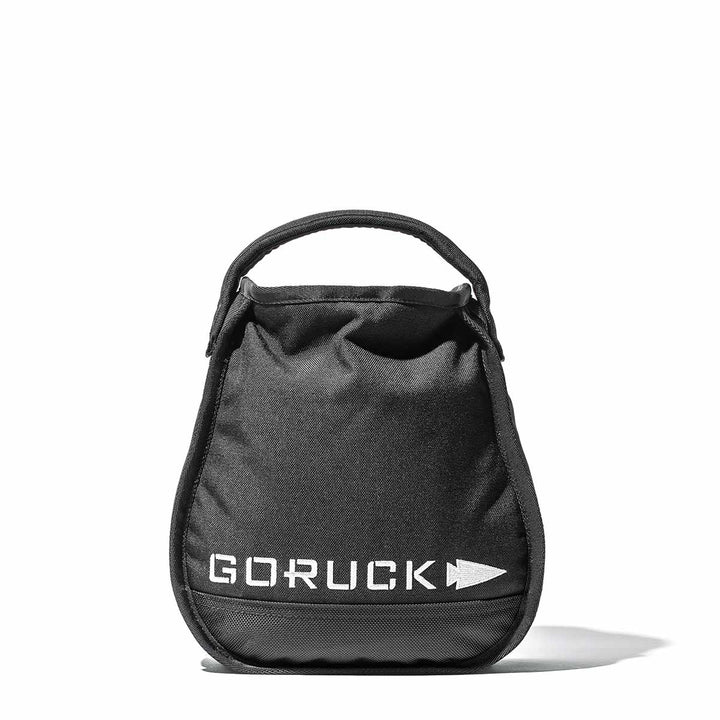 A black Sand Kettlebell by GORUCK, featuring a handle and logo, designed for endurance workouts, is placed on a white background, highlighting its portable kettlebell advantages.