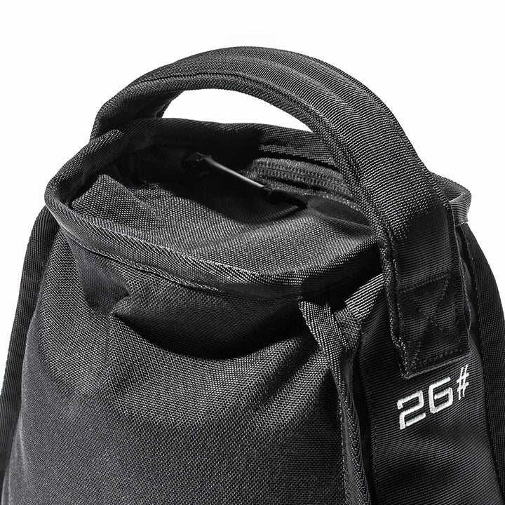 Close-up of a black fabric bag with a handle, featuring "2G#" embroidered in white on the front, crafted by GORUCK with durability in mind for their Sand Kettlebells collection.