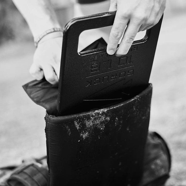 A person uses the GORUCK Training Weight Vest 2.0 for an intense workout, eliminating the need to create a makeshift weight vest from Ruck Plates in a backpack.